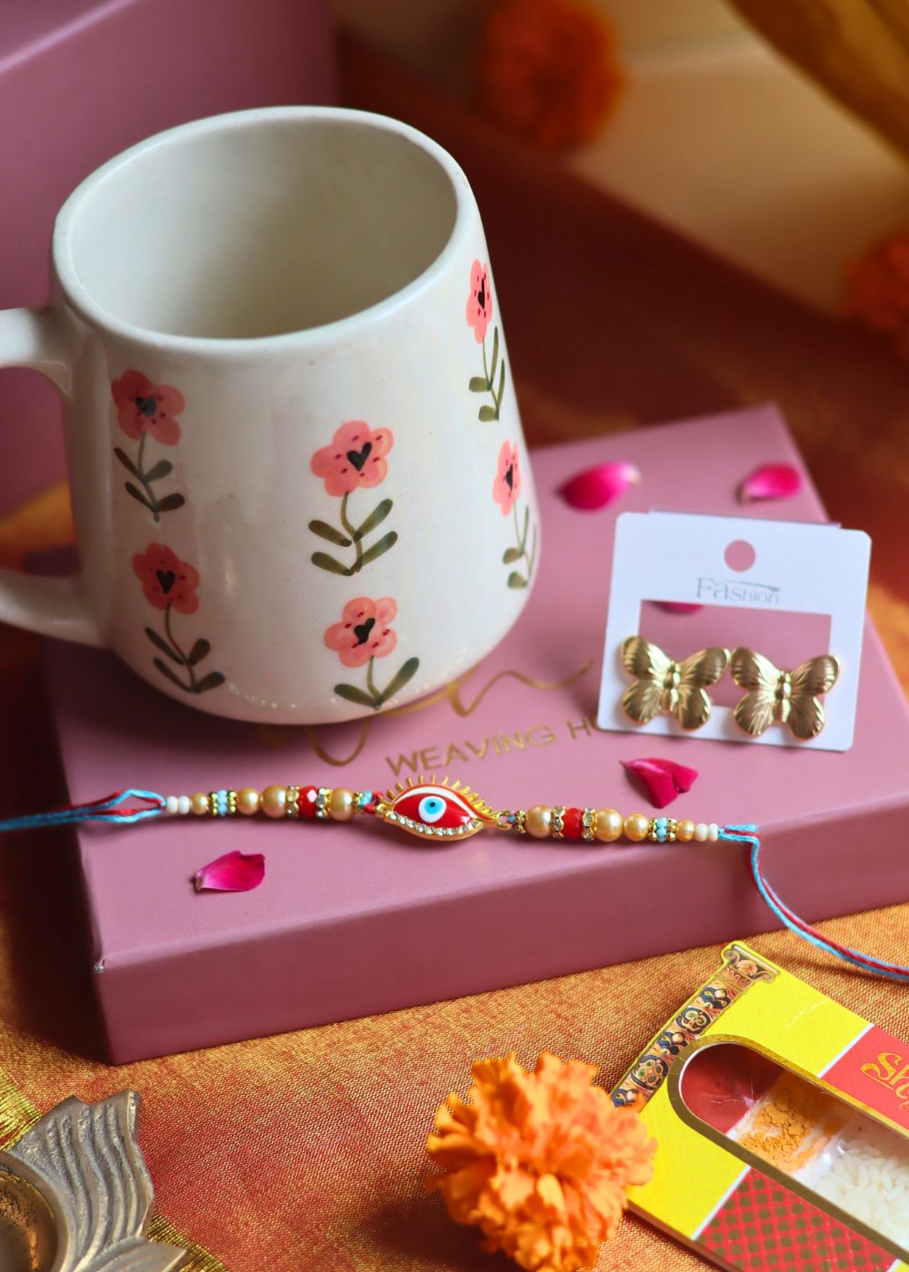 Rakhi Poppy Mug gift box with Rakhi & Earrings only for your siblings