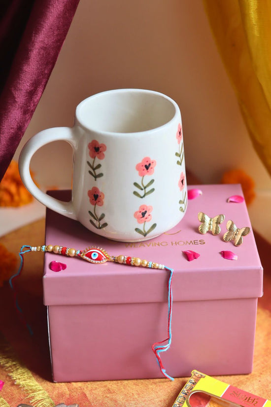 Rakhi Poppy Mug gift box with Rakhi & Earrings combo is crafted only for this rakhsha bandhan