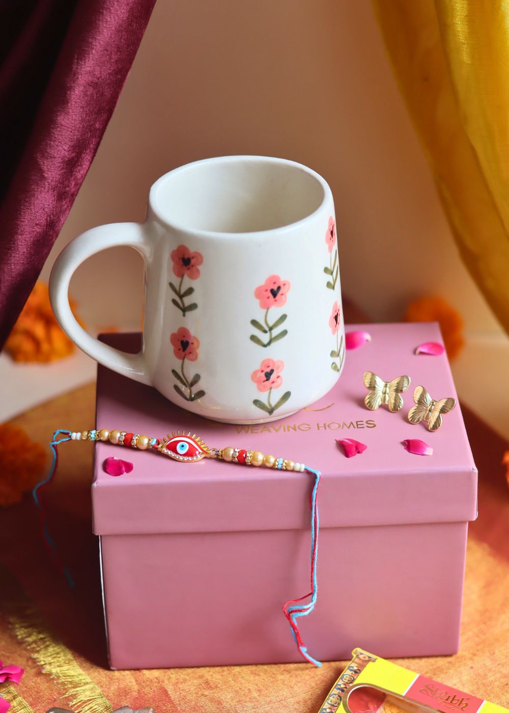 Rakhi Poppy Mug gift box with Rakhi & Earrings combo is crafted only for this rakhsha bandhan