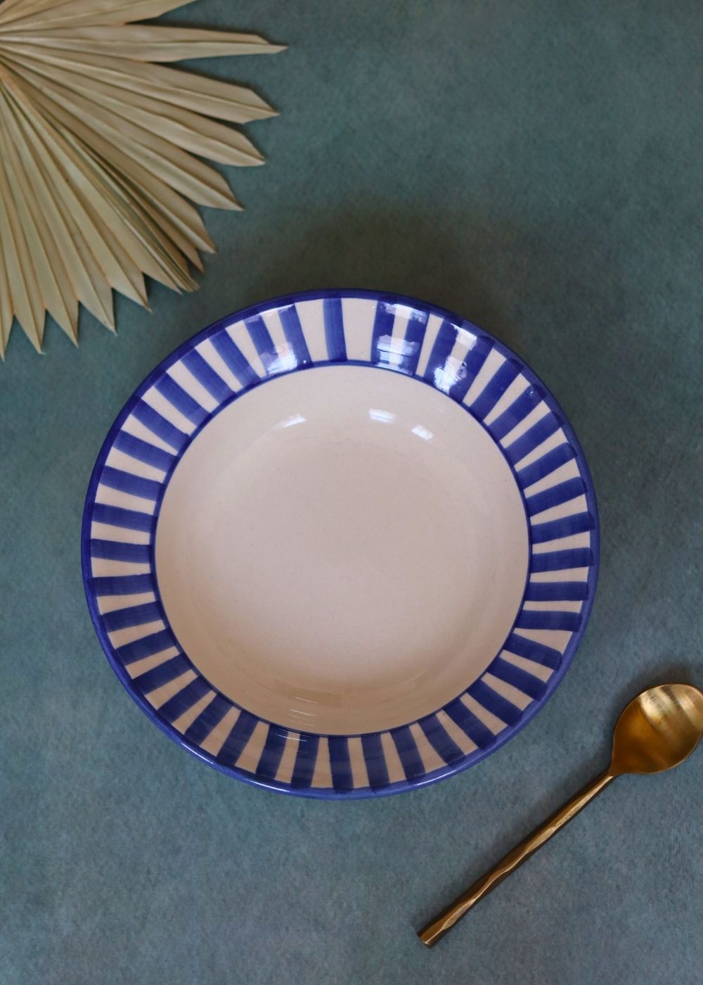 blue striped pasta plate made by ceramic