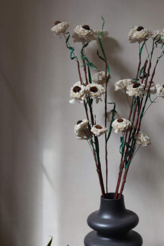 Flower bunch with black vase