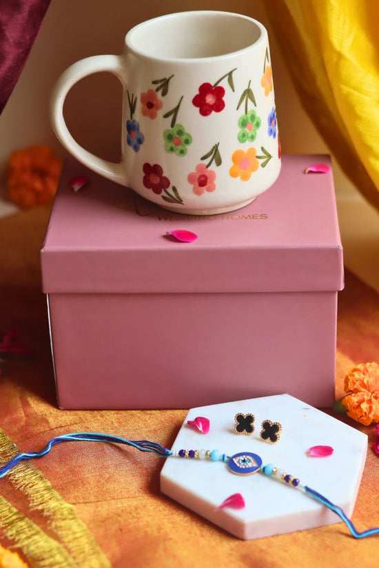 Rakhi Floral Blossom Mug gift box with Rakhi & Earrings is crafted only for this rakhsha bandhan