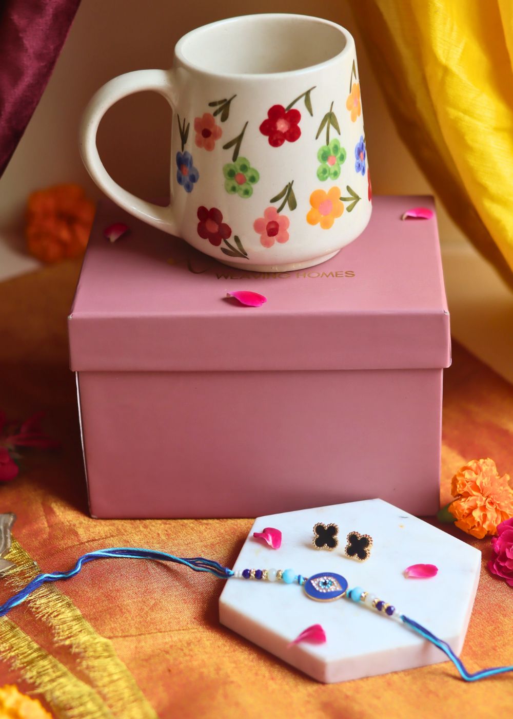 Rakhi Floral Blossom Mug gift box with Rakhi & Earrings is crafted only for this rakhsha bandhan