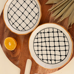 Criss cross snack plate on wooden tray
