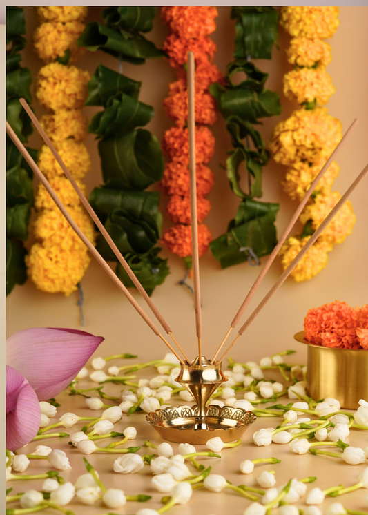 Golden aura agarbatti stand in temple 