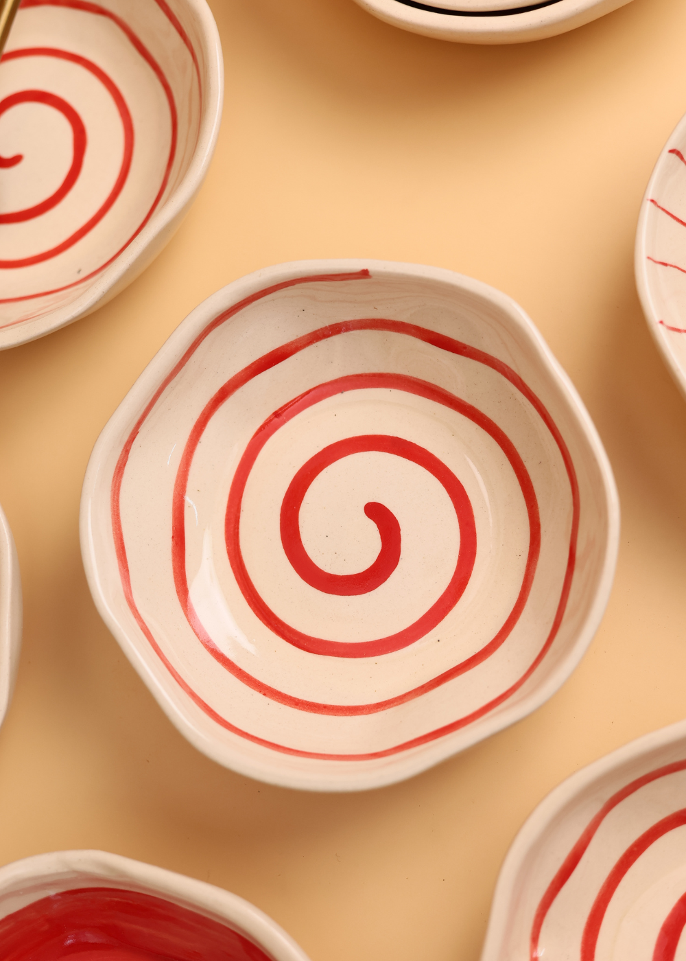 ceramic red spiral bowl with red & white color