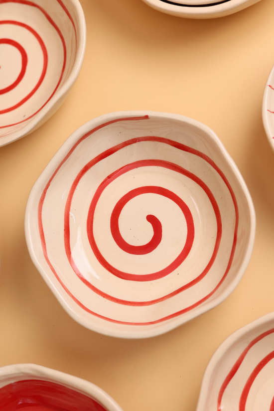 ceramic red spiral bowl with red & white color