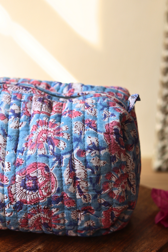 Closeup shot block printed toiletry bag on a wooden surface