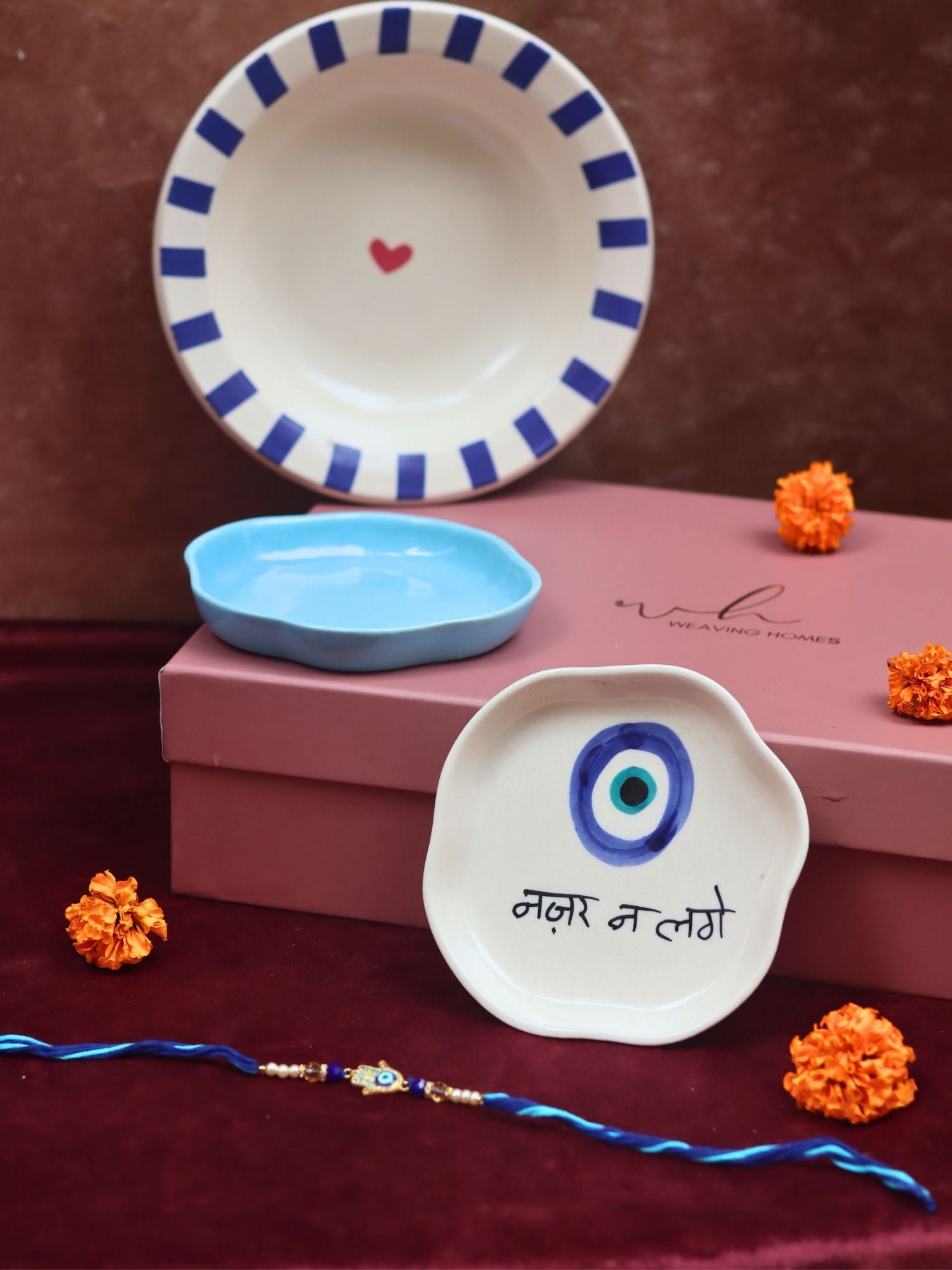 The Evil eye Luxe Rakhi Gift Hamper made by ceramic