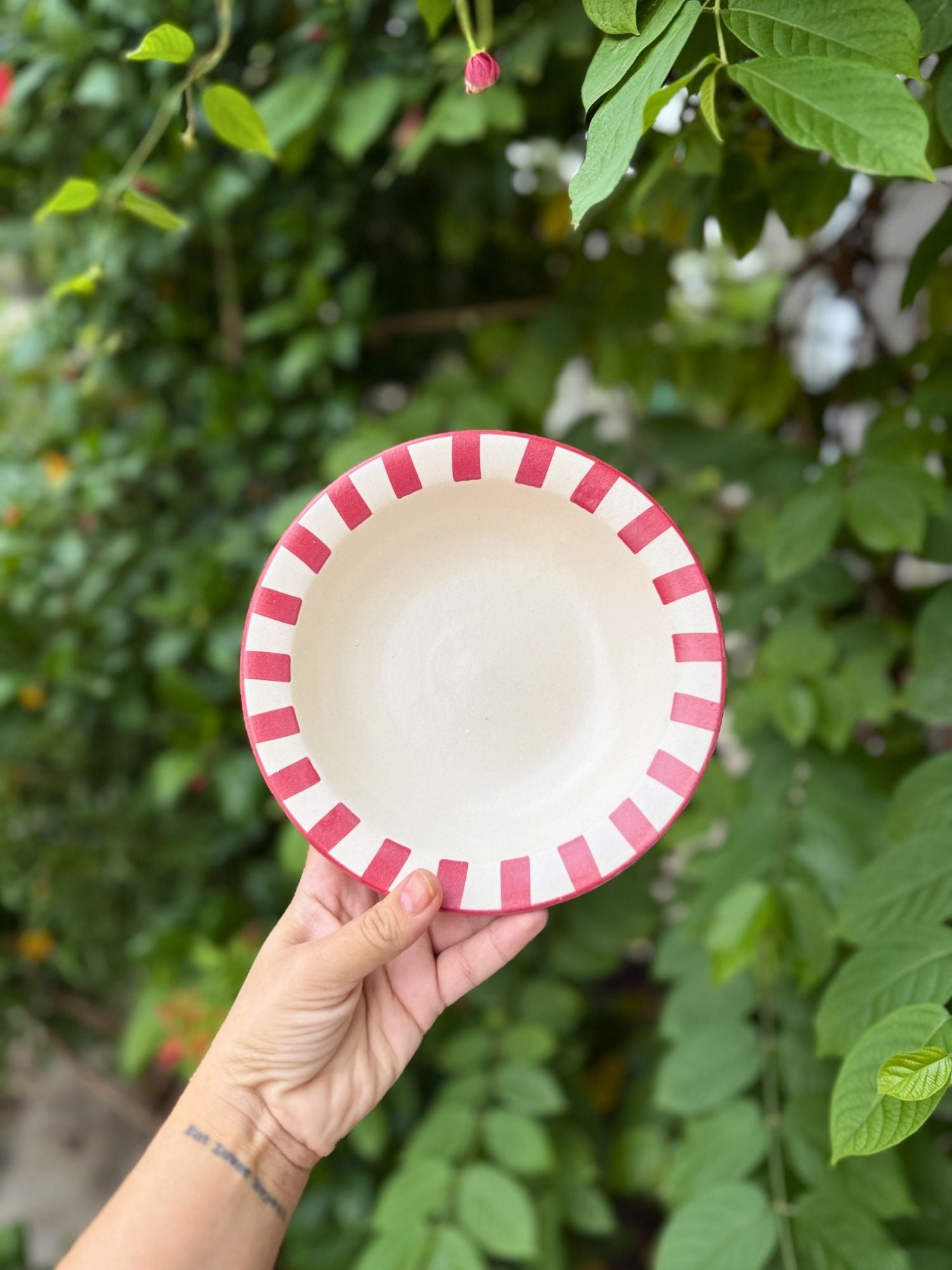 Red striped pasta plate made by ceramic