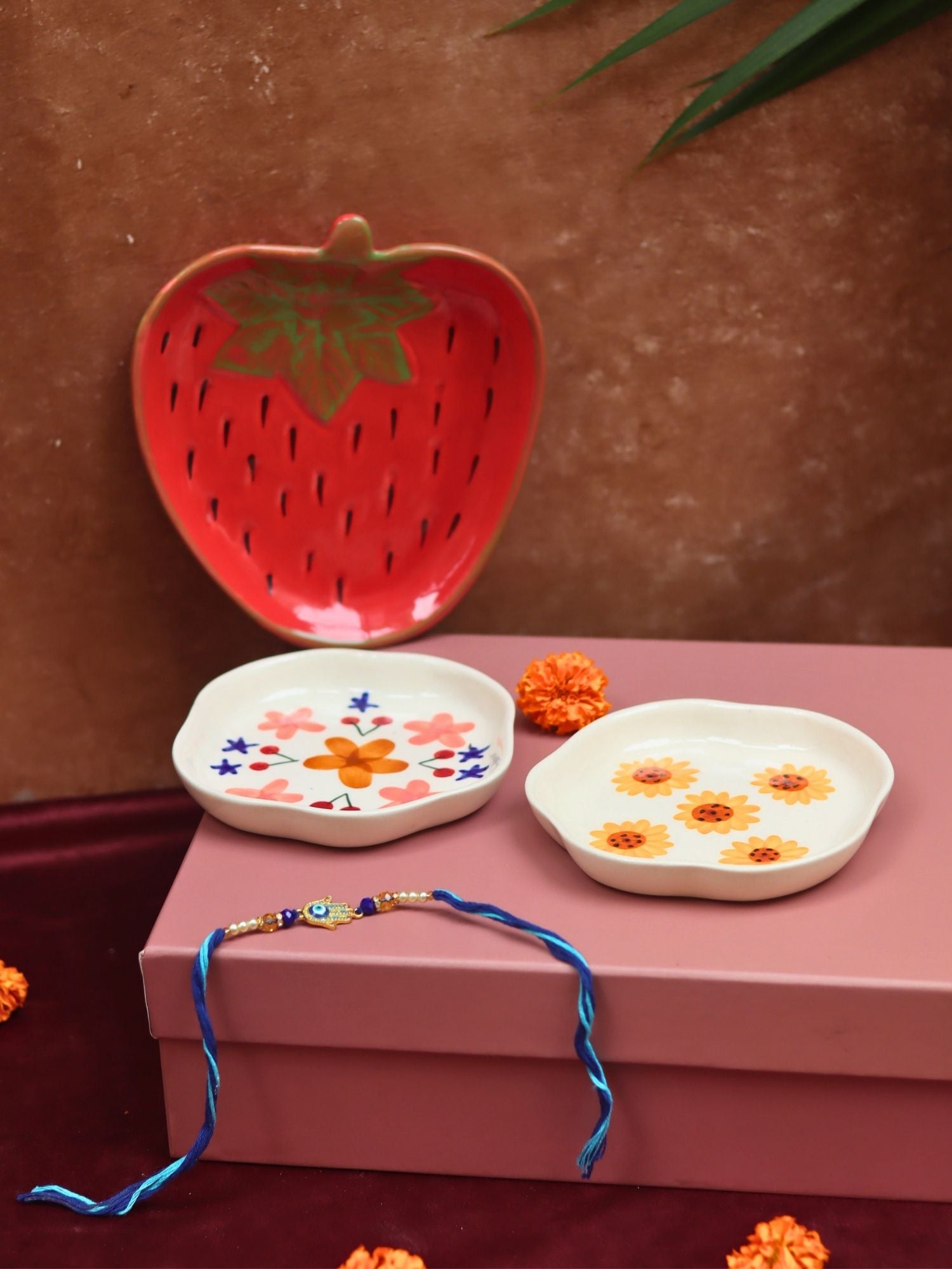 The Blissful Bloom Luxe Rakhi Gift Hamper made by ceramic