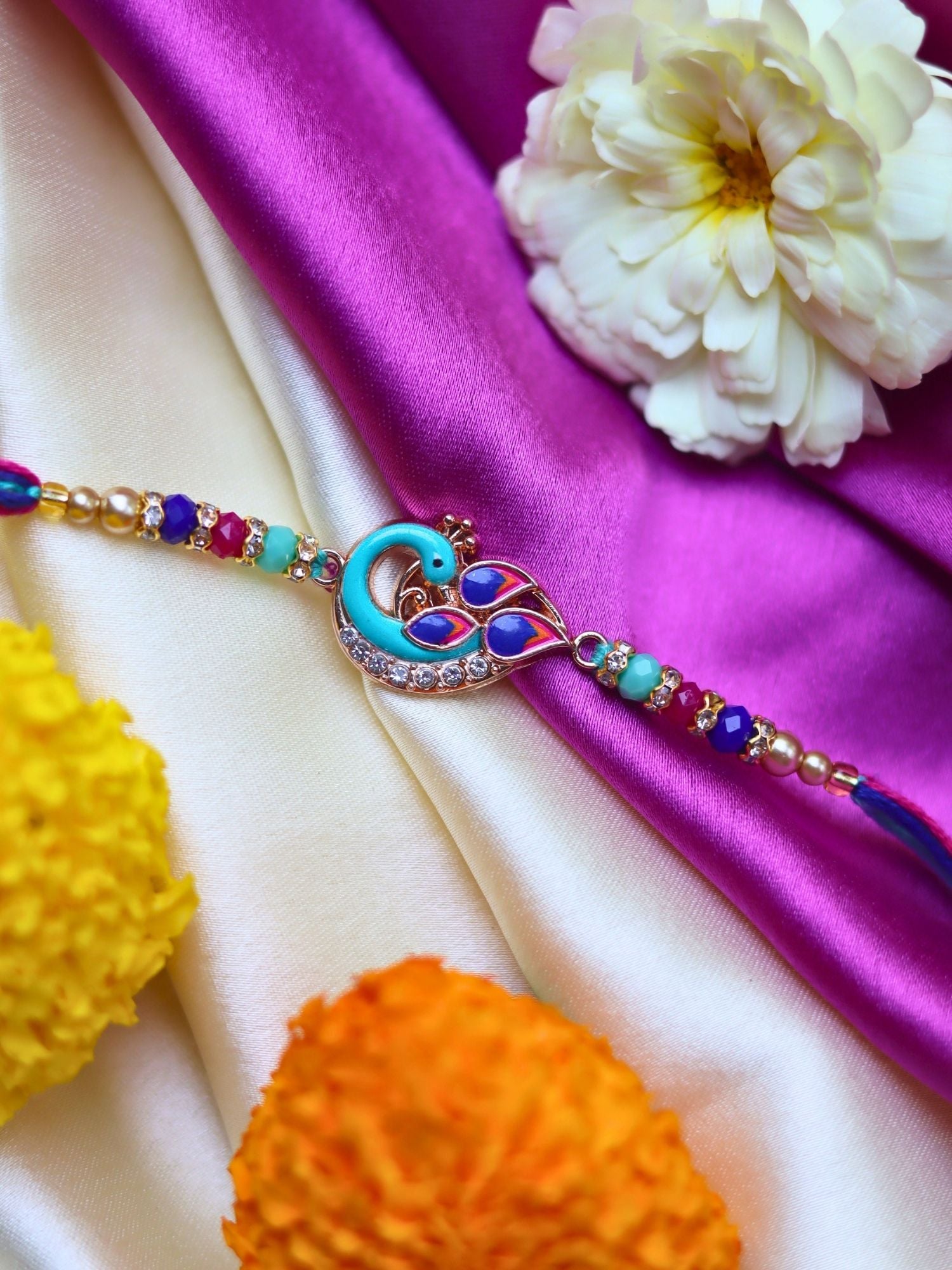 Peacock Rakhi made with premium quality materal