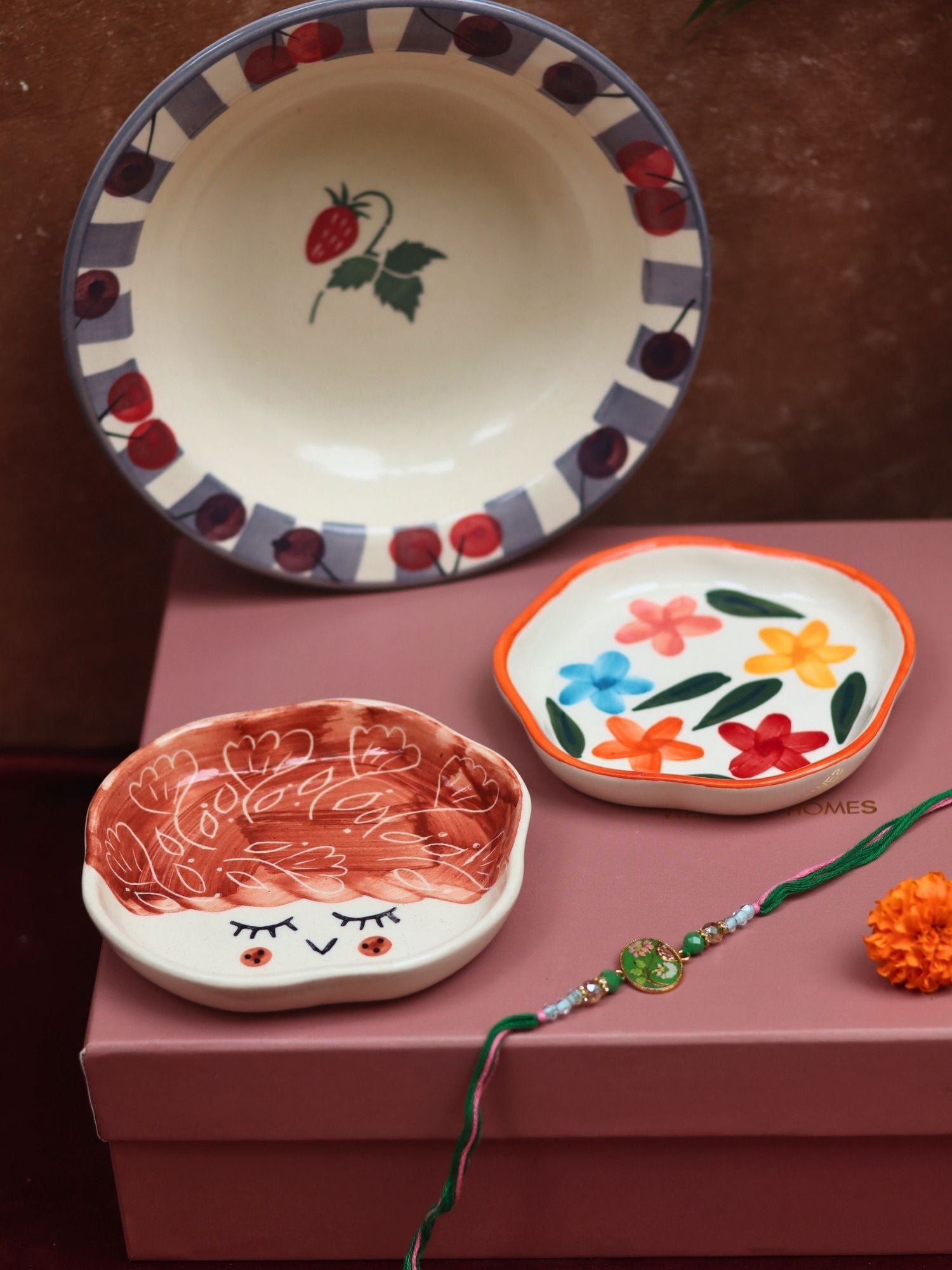 The Cherry Bliss Luxe Rakhi Gift Hamper made by ceramic