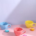 blue, yellow & pink coffee mugs made by ceramic 