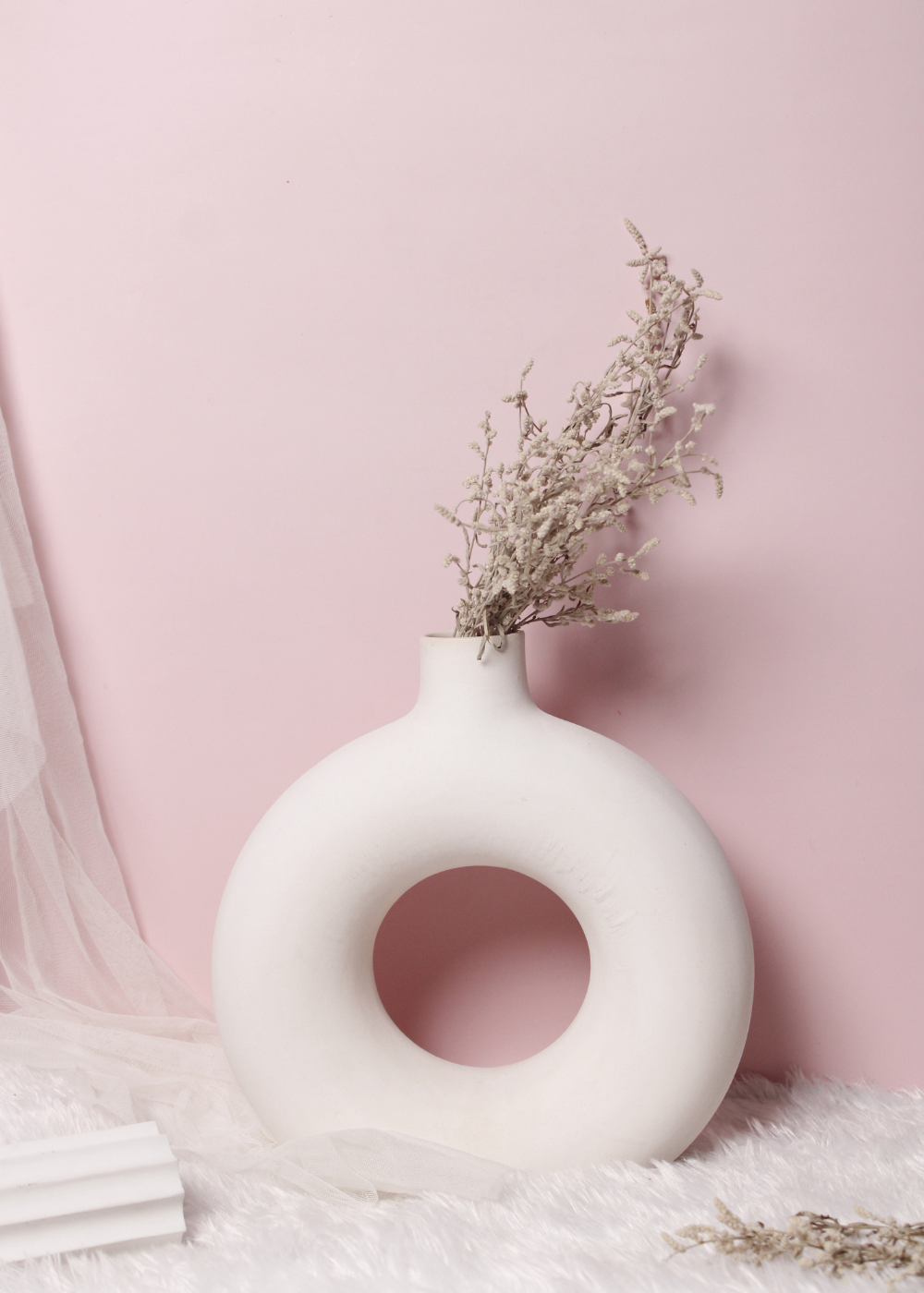 White donut flower vase with flowers