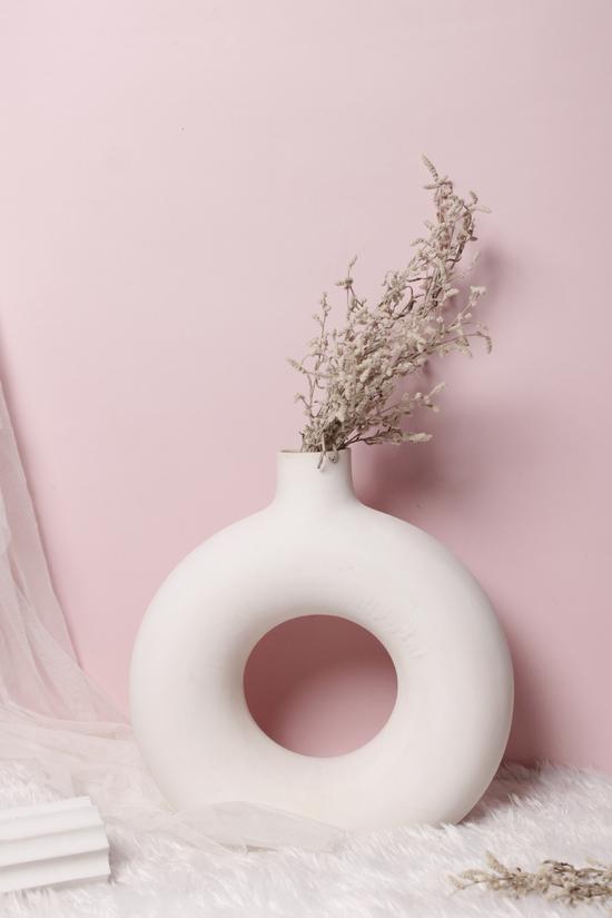 White donut flower vase with flowers