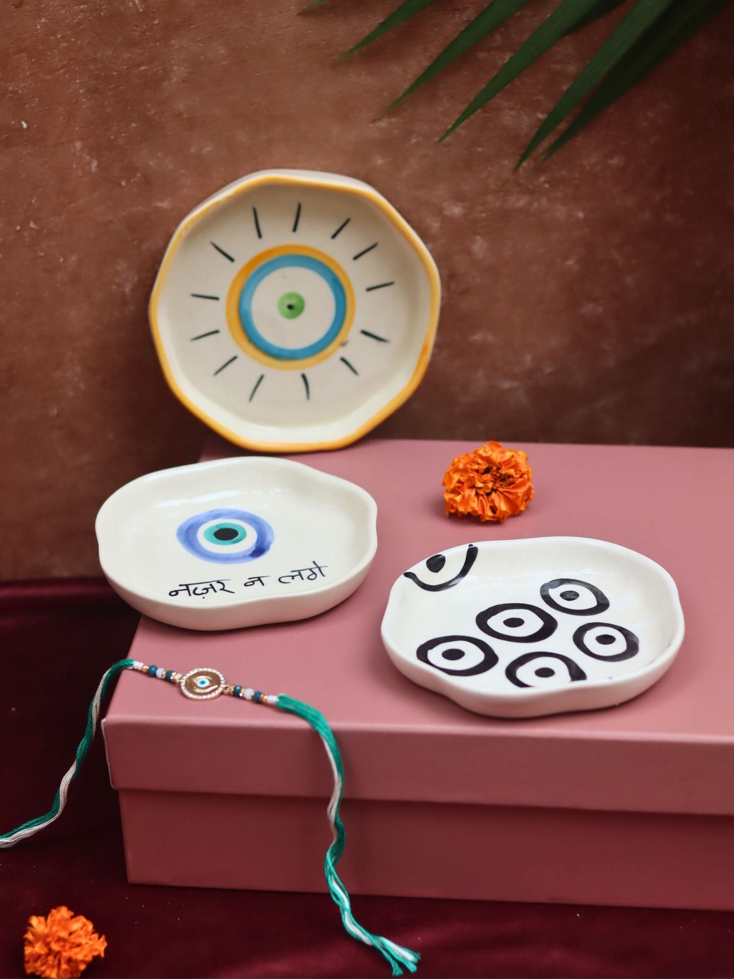 The Nazar Charm Luxe Rakhi Gift Hamper made by ceramic