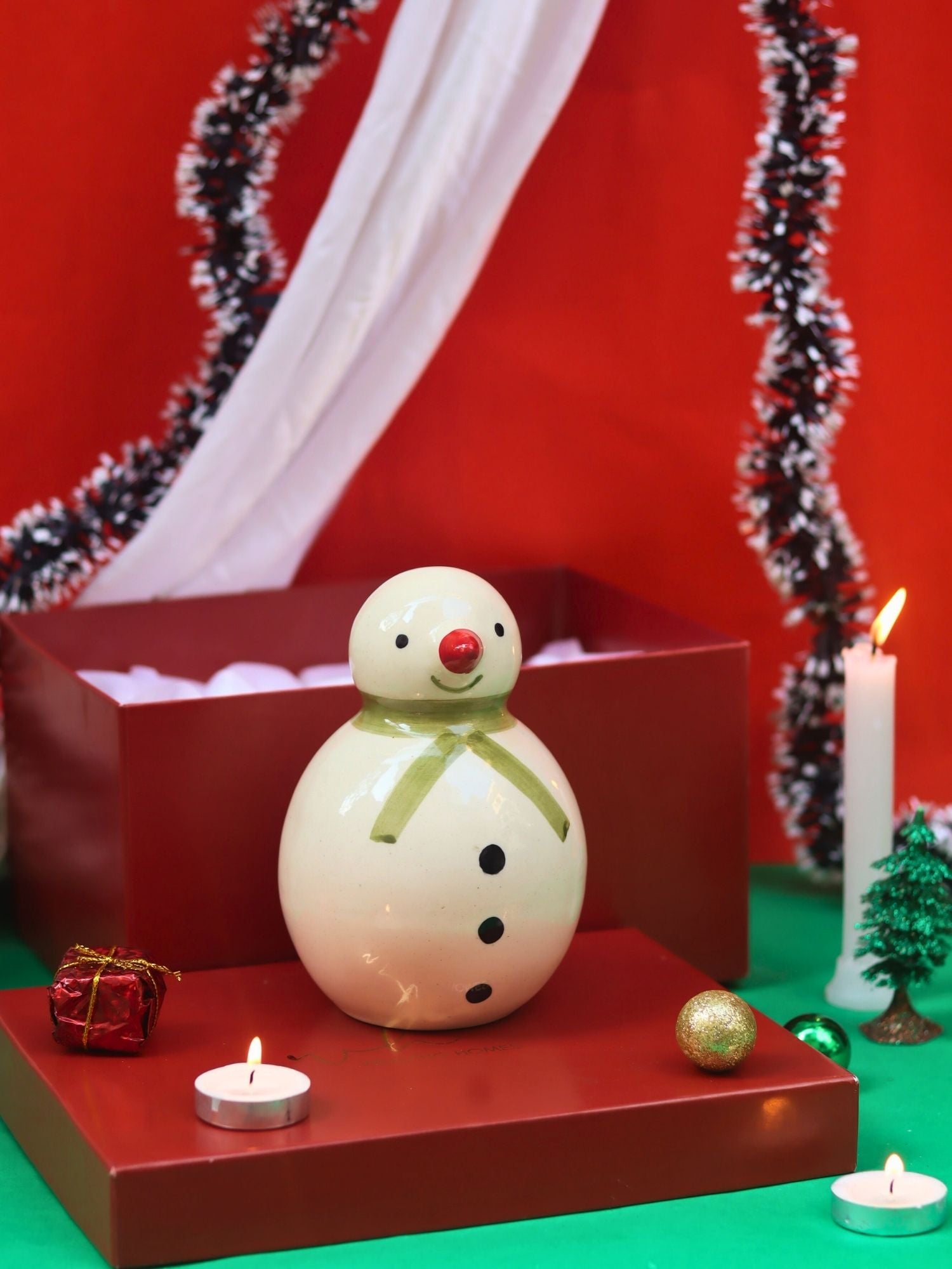 The Christmas Snowman in a Gift Box made by ceramic