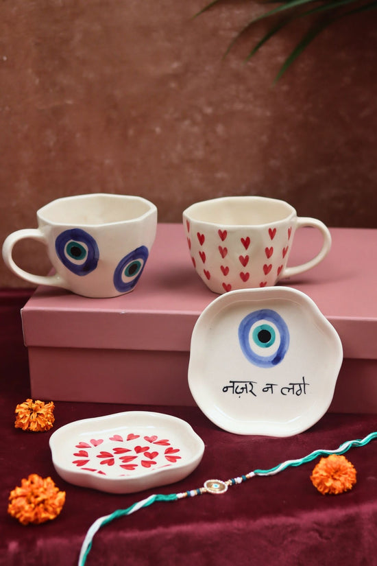 The Heart & Evil eye Luxe Rakhi Gift Hamper made by ceramic