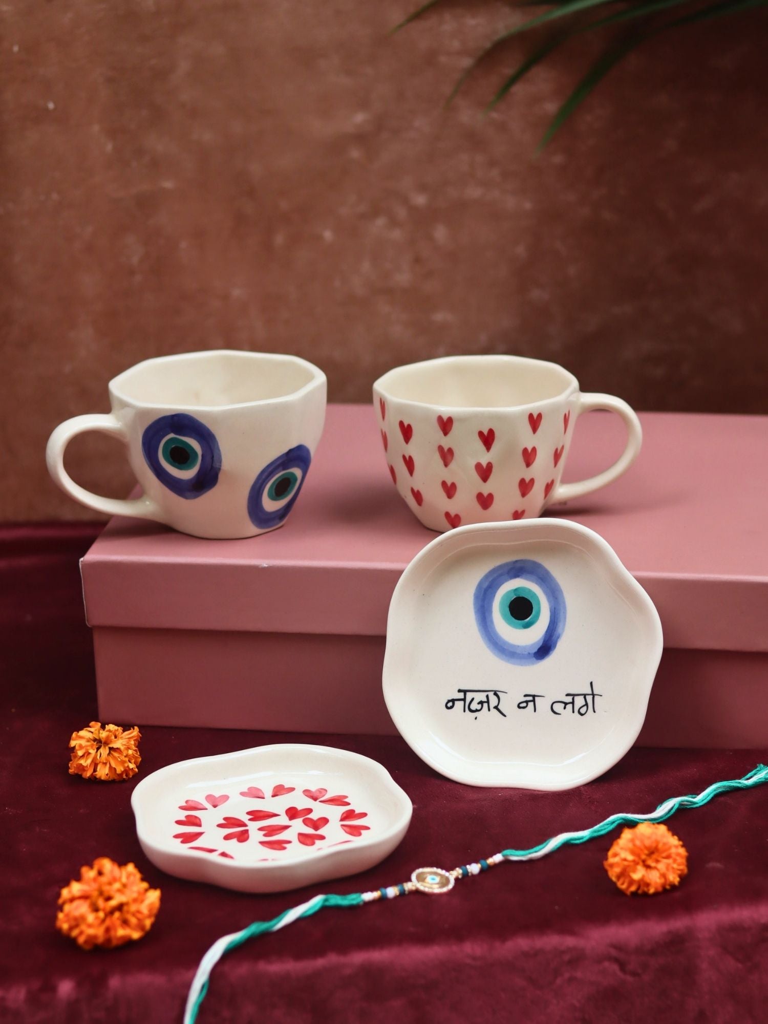 The Heart & Evil eye Luxe Rakhi Gift Hamper made by ceramic