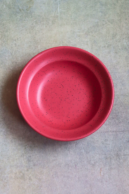 Deep red pasta plate top shot