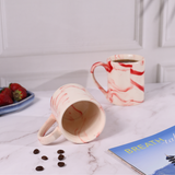 red & white marble mug with red marble shades
