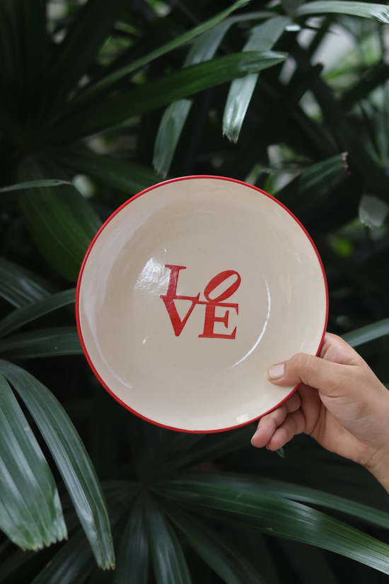 Ceramic love snack plate in hand 