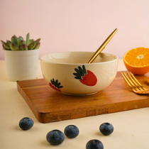 Ceramic bowl with spoon