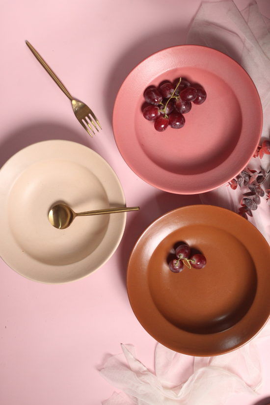 handmade pasta plates with golden cutlery