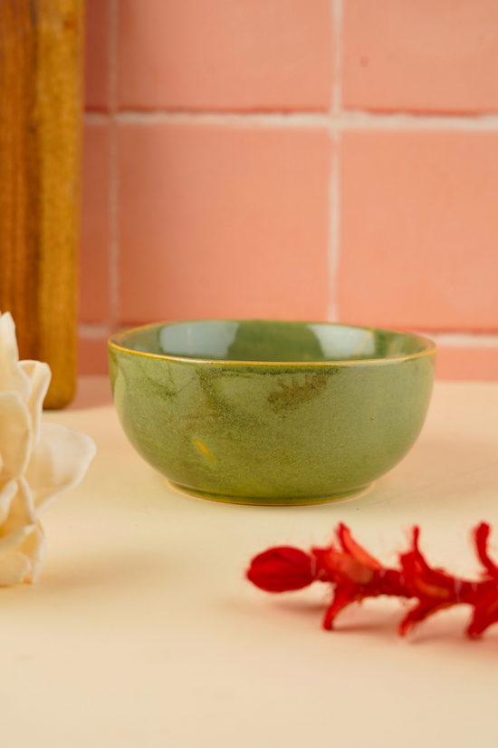 handmade bowl with green color and glossy look