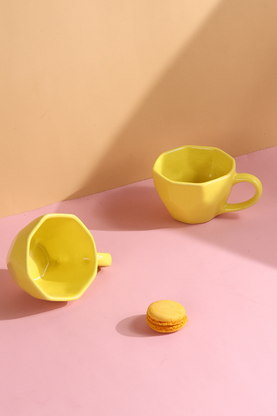pink & yellow mug made by ceramic 