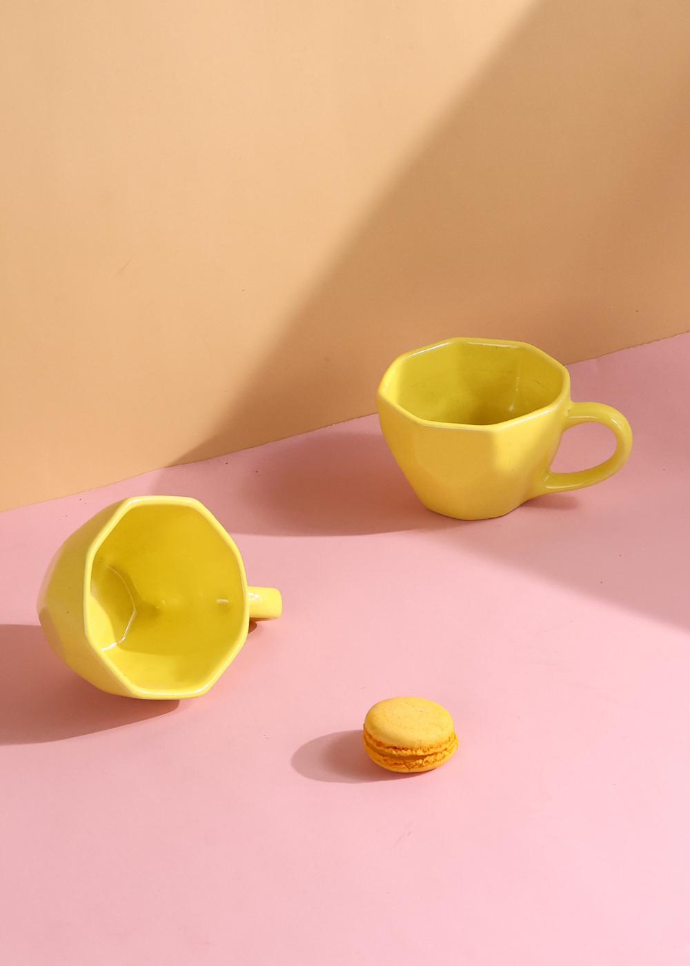 pink & yellow mug made by ceramic 