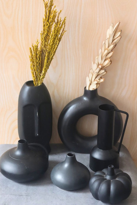 black vases made by ceramic 