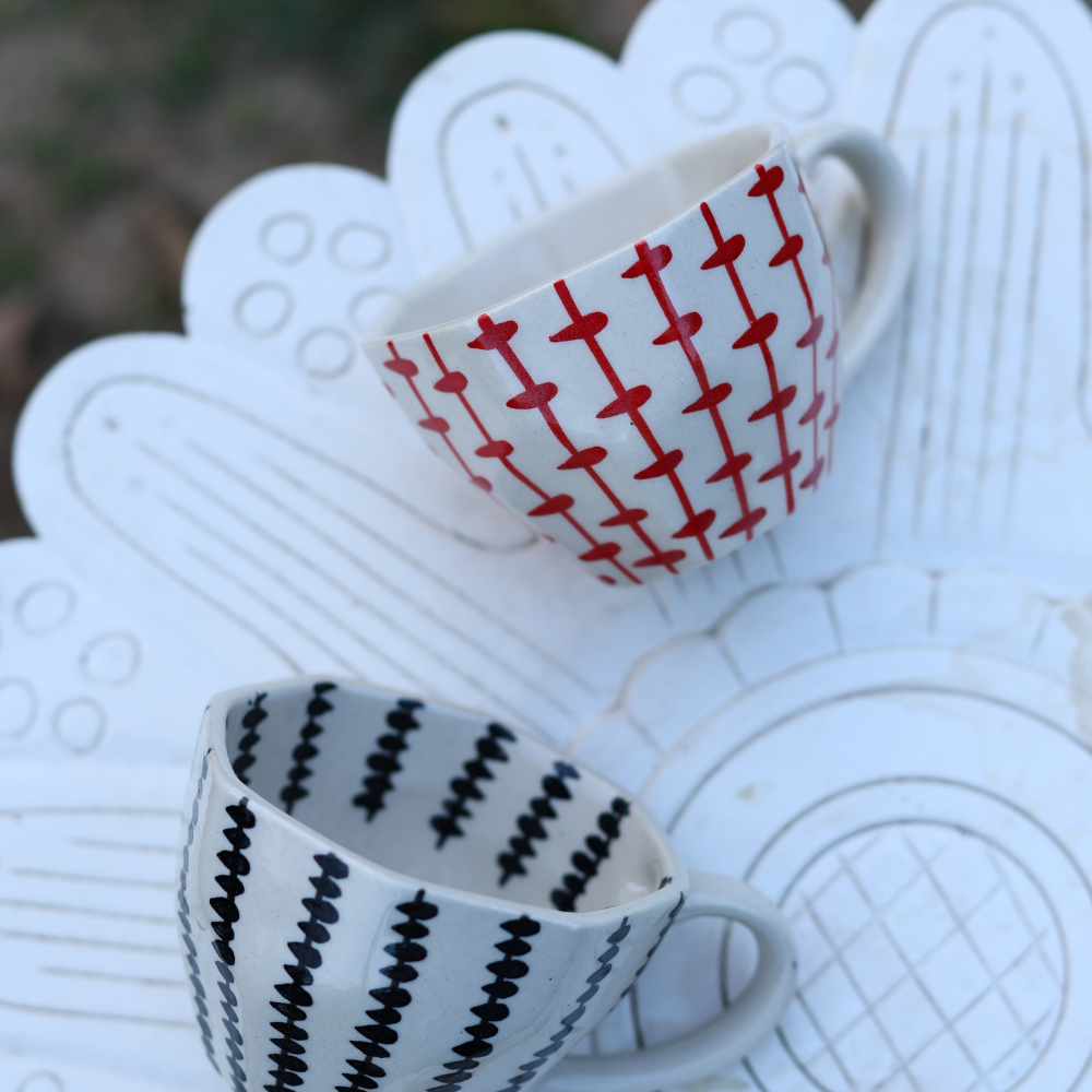 red & black crosses mug made by ceramic 