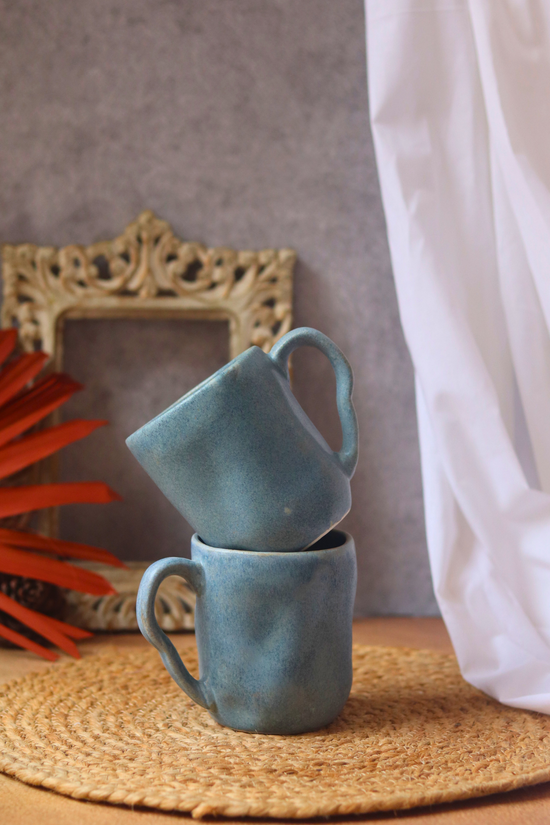 Ceramic coffee mugs on each other