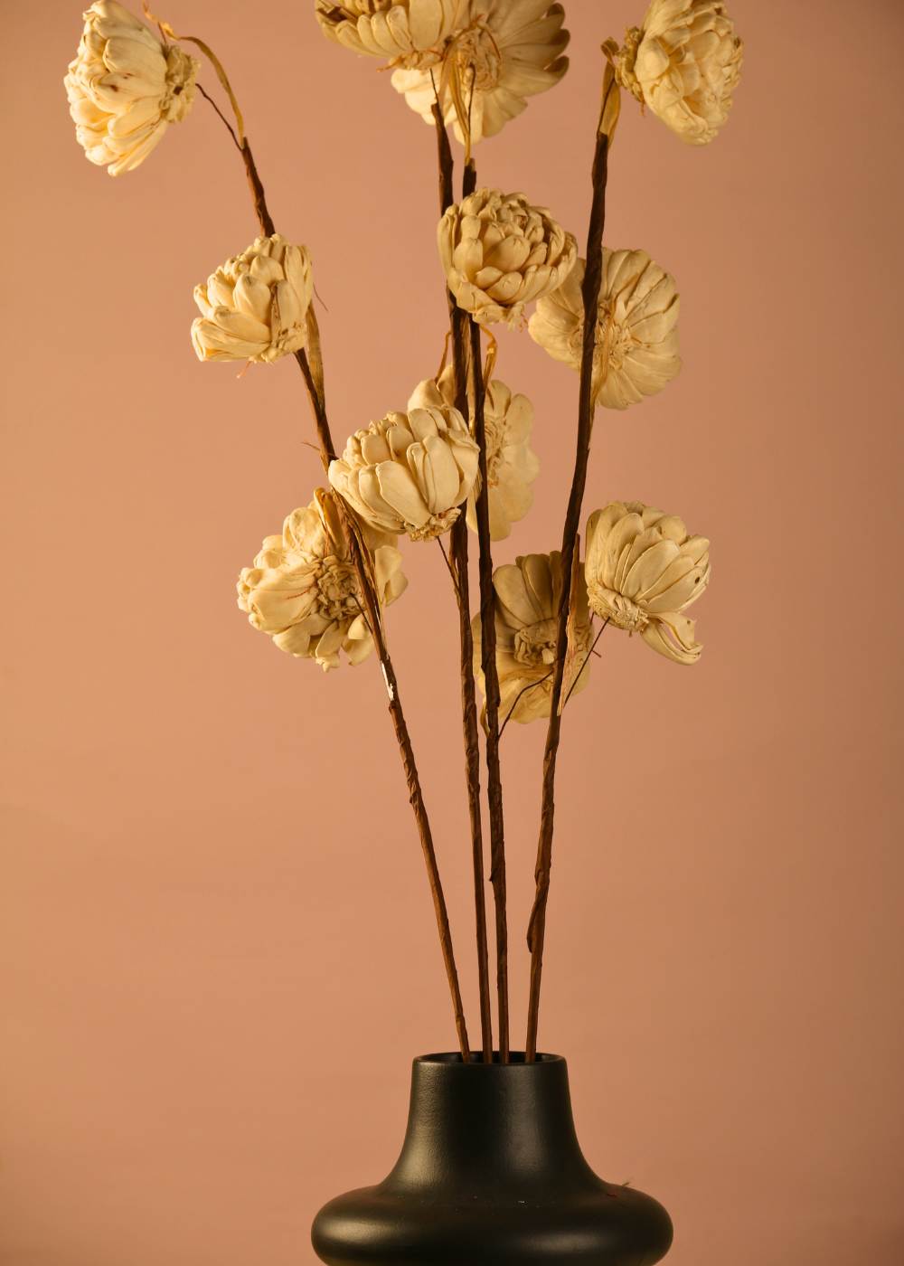 Dried flower bouquet with black vase