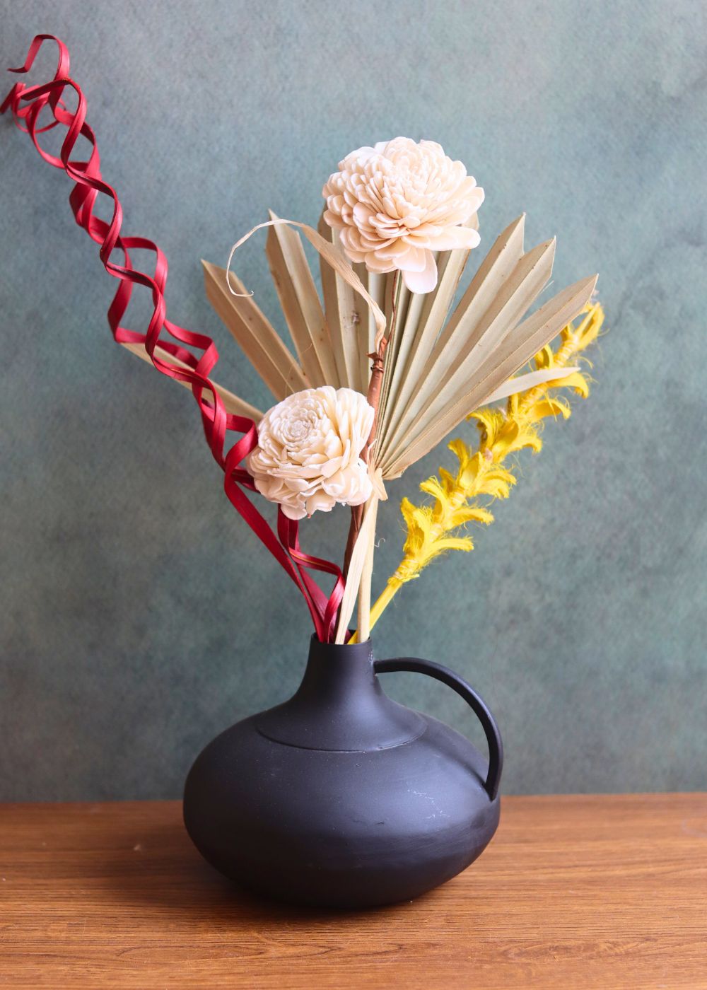 handmade black handle vase with assorted bunch combo