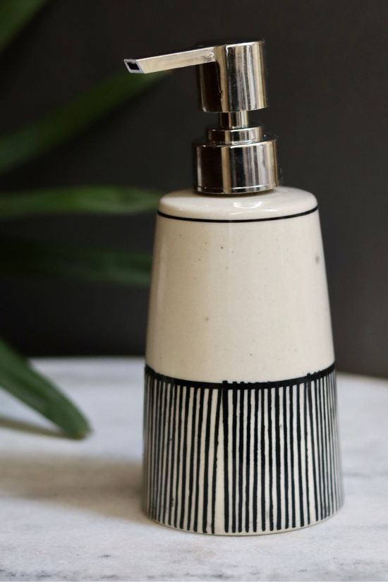 black lined soap dispenser