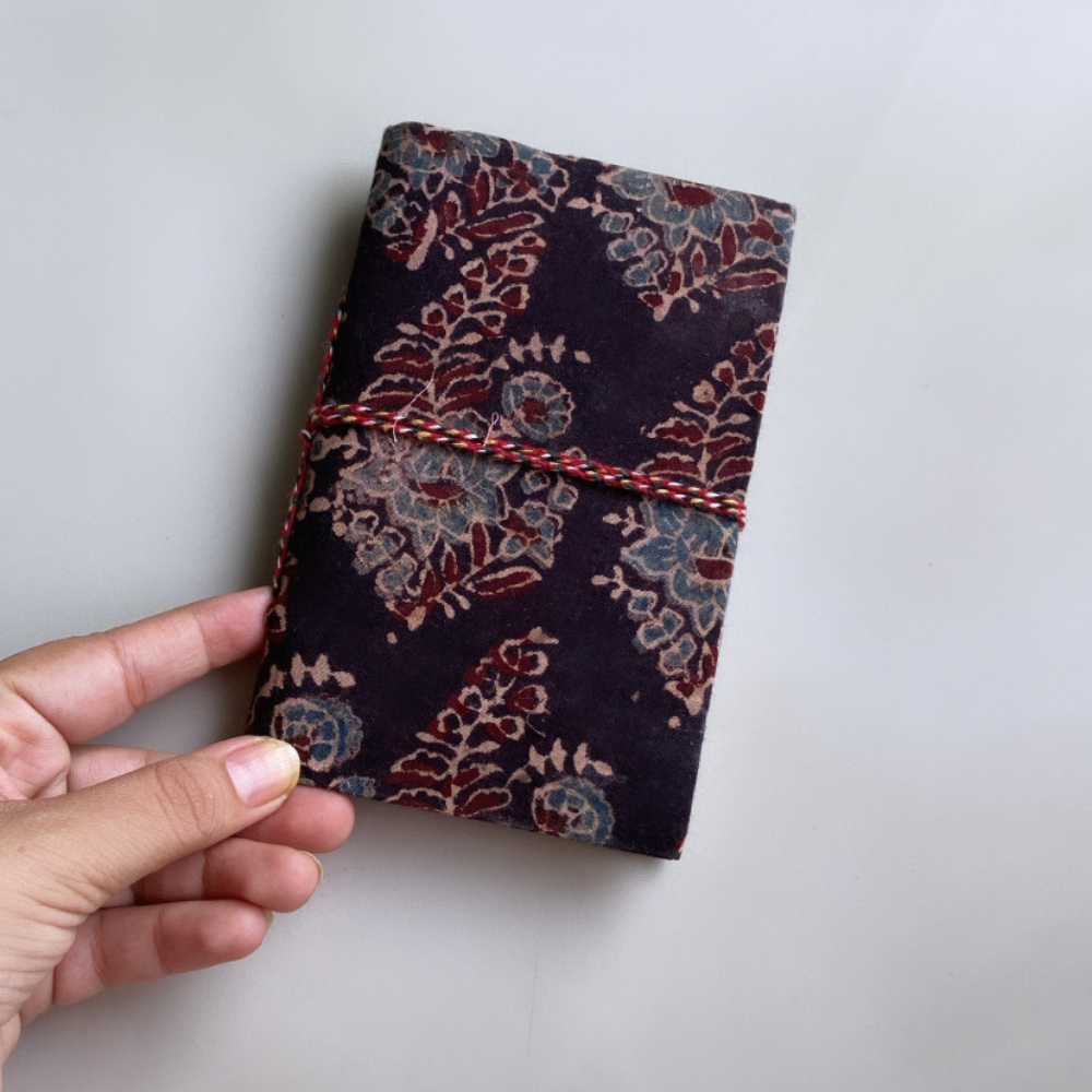 Black blockprints handmade diary in a hand