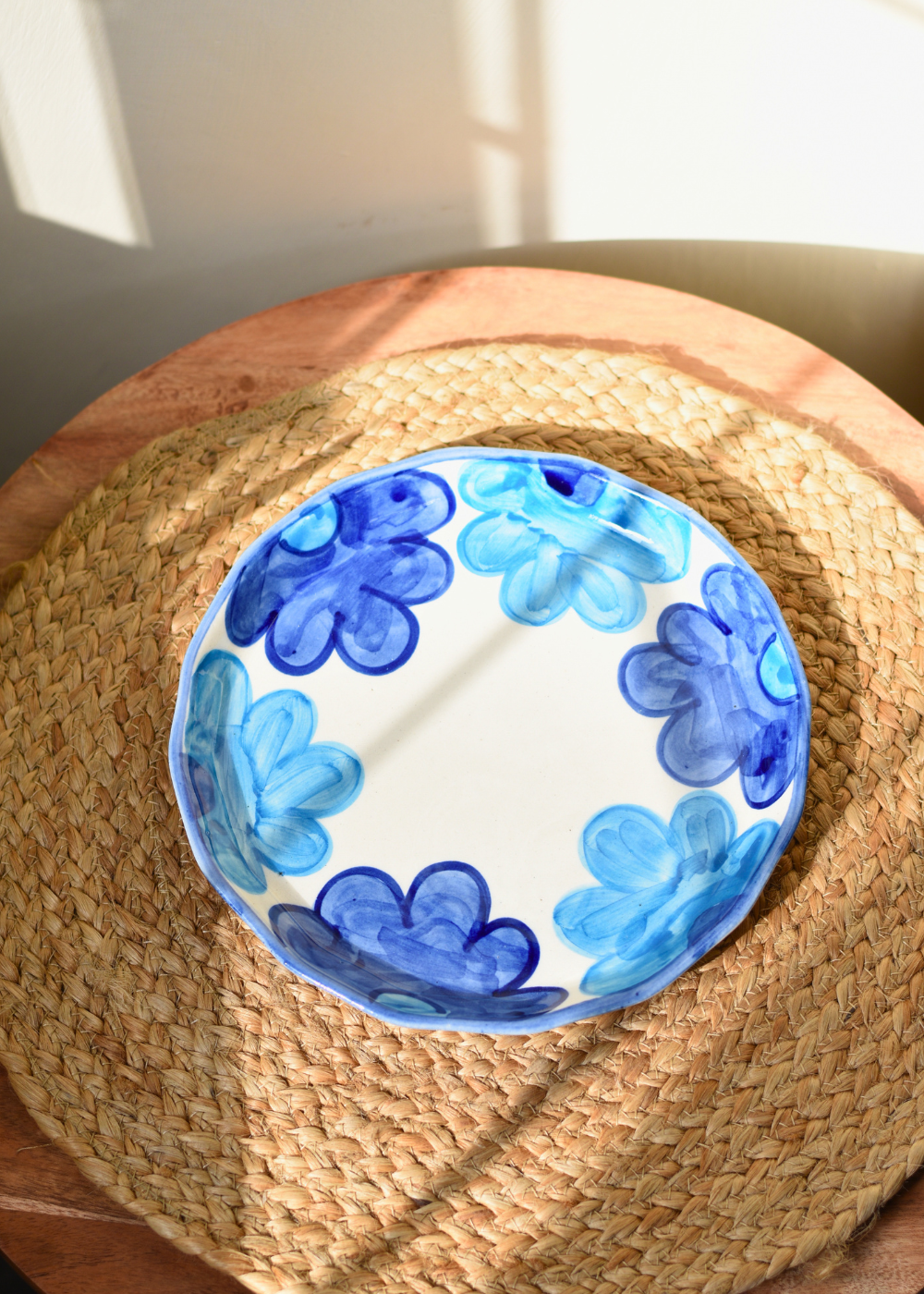 Blue floral plate on a mat