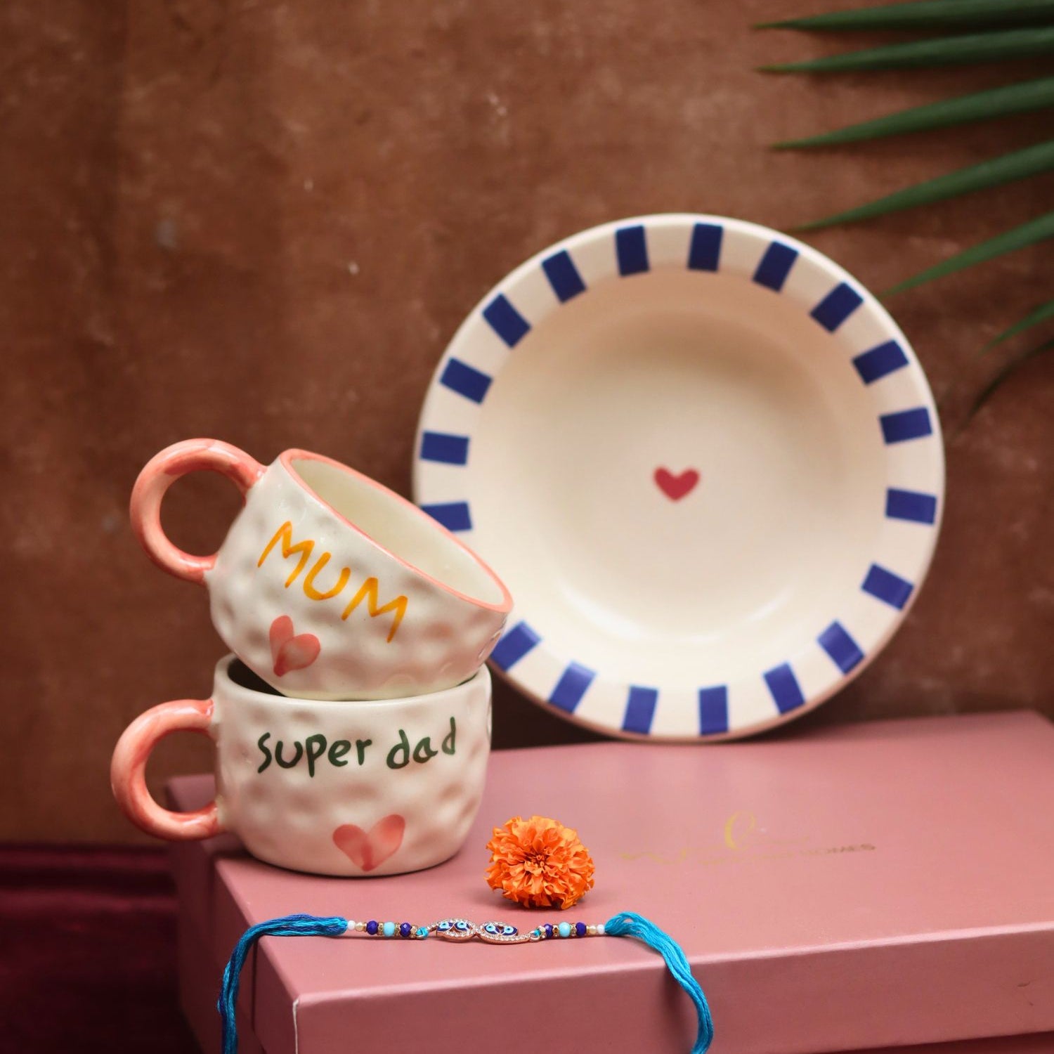 The Special Mum & Dad Luxe Rakhi Gift Hamper made by ceramic