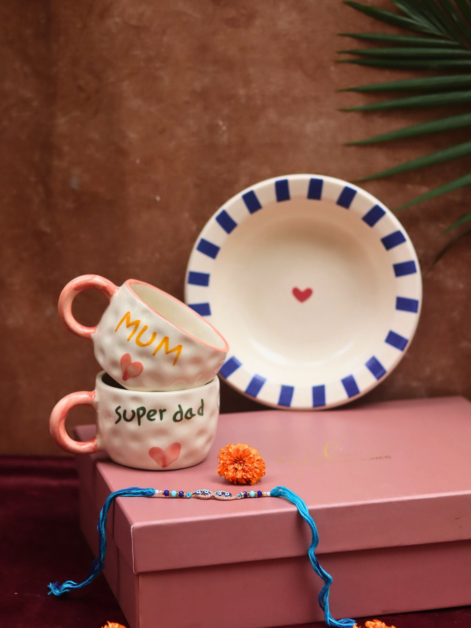 The Special Mum & Dad Luxe Rakhi Gift Hamper made by ceramic