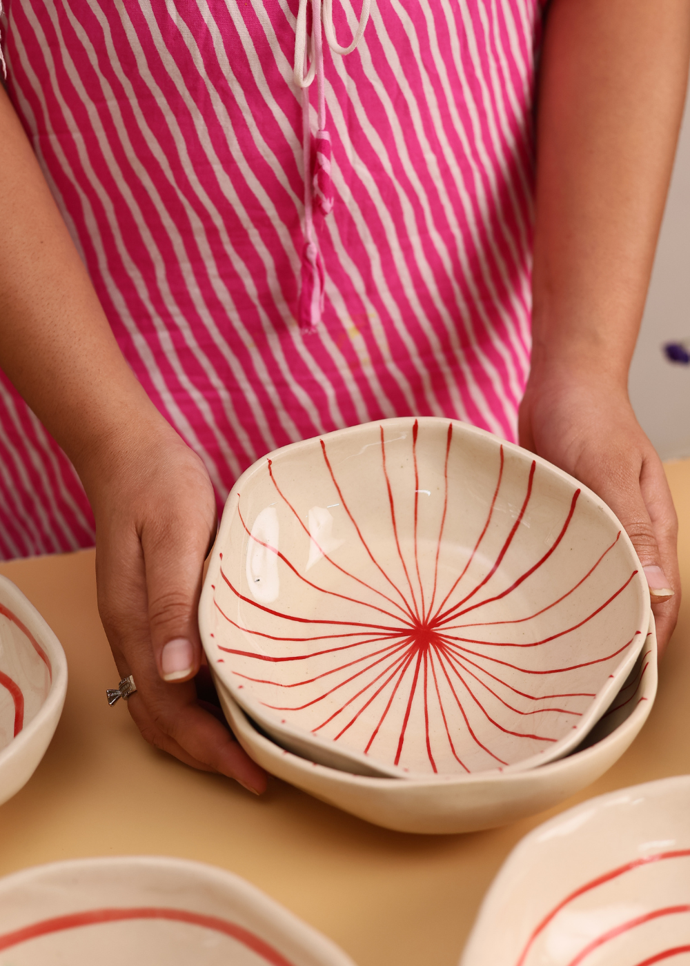 White bowl with red lines design 