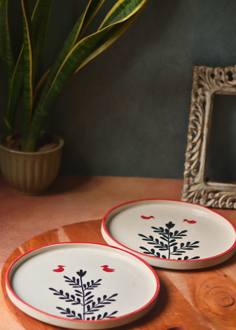 Two handmade ceramic platters birds & plant design