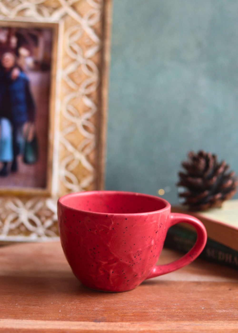 red textured mug made by ceramic 
