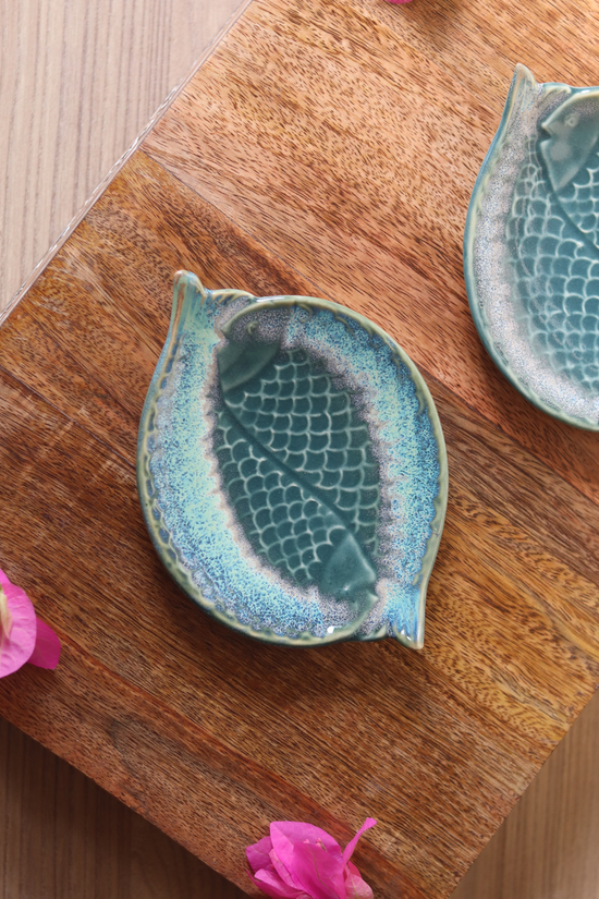 Dual fish platter on wooden surface