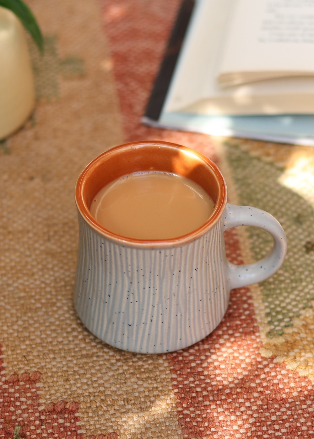 Grey chai cup with chai 