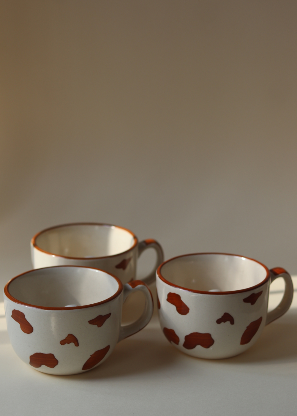 Three ceramic dog mugs