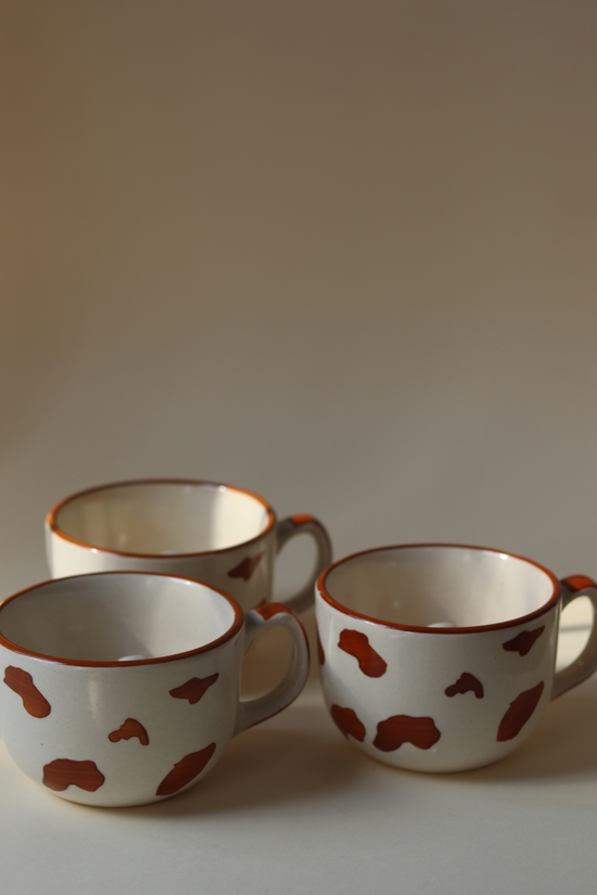 Three ceramic dog mugs