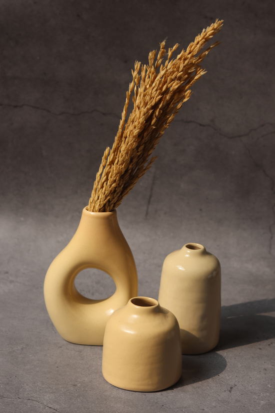 set of three vases with cream color